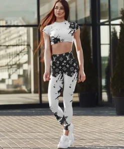 Black–white splash monogram activewear set – fitted crop top & high-waist leggings